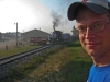 Peter with the WMSTR 313 Train in the background at the Western Minnesota Steam Threshers Reunion.