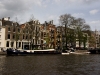 Some houses and boat houses on a canal in Amsterdam.