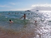 Aaron, Preston and Liz swimming in the ocean.